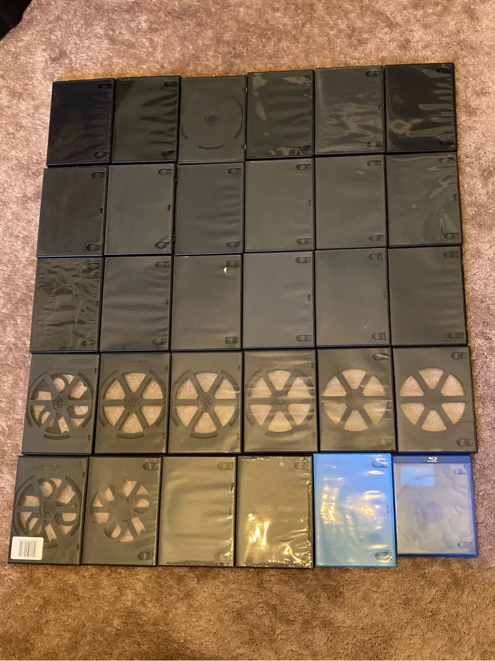 Assorted Empty DVD/Blu‑ray Plastic Cases in Black and Blue